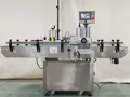Étiqueteuse automatique pour bouteilles rondes