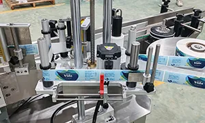 Étiqueteuse automatique pour bouteilles rondes